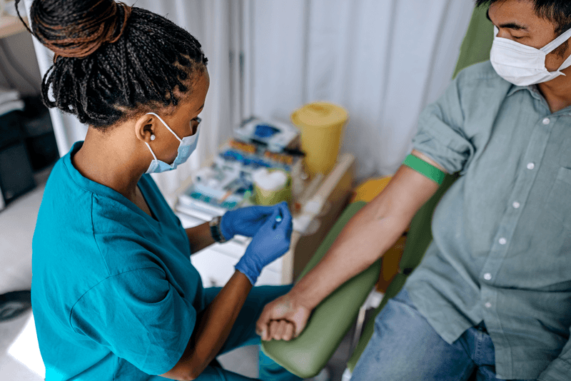 Nurse preparing patient to do a blood analysis - stock photo
Nurse preparing patient to do a blood analysis