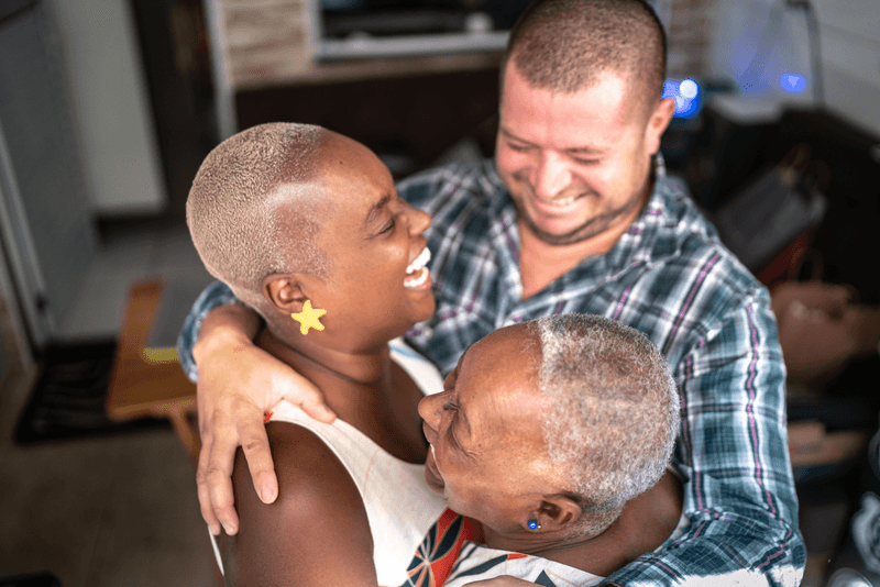 Family embracing at home - stock photo
Family embracing at home