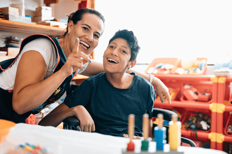 Teacher playing with boy with Cerebral Palsy - stock photo
Teacher playing with boy with Cerebral Palsy in Classroom